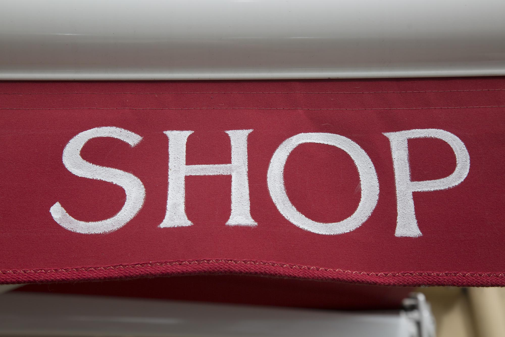 Studio storefront with embroidered signage
